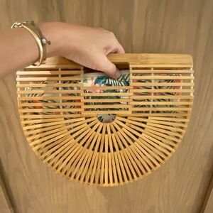 Vintage style bamboo clutch with removal insert liner.